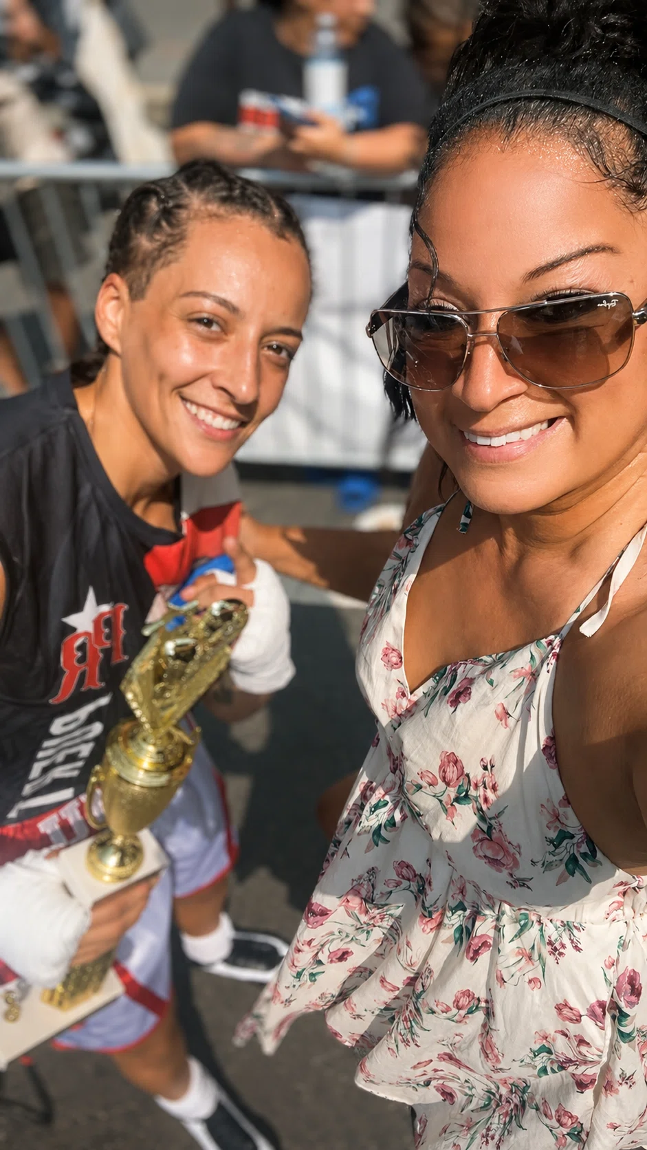 Primal family celebrating a boxing victory with a trophy