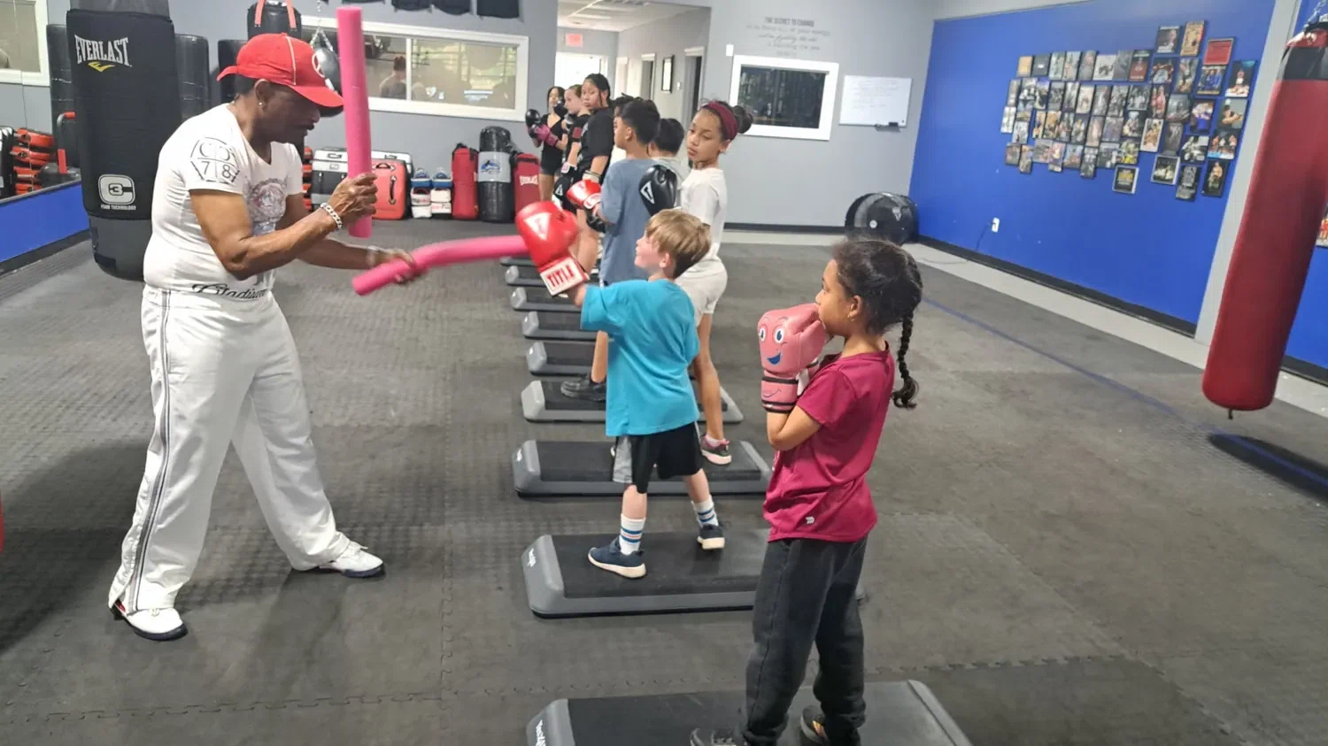 Coach leading youth boxing fundamentals class