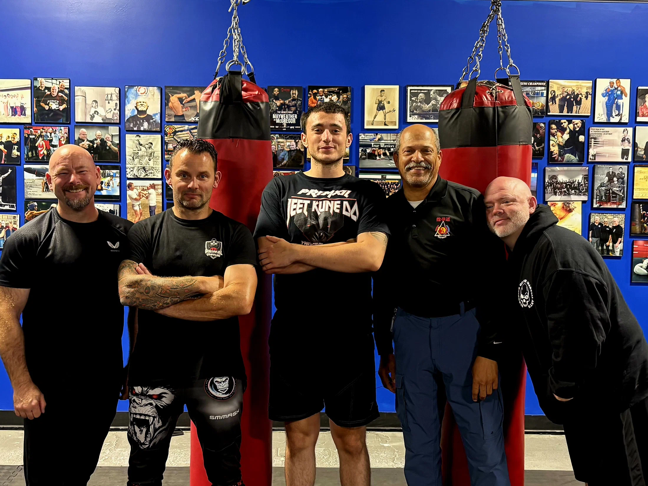 Training class group photo at Primal Jym with combat camp certificates
