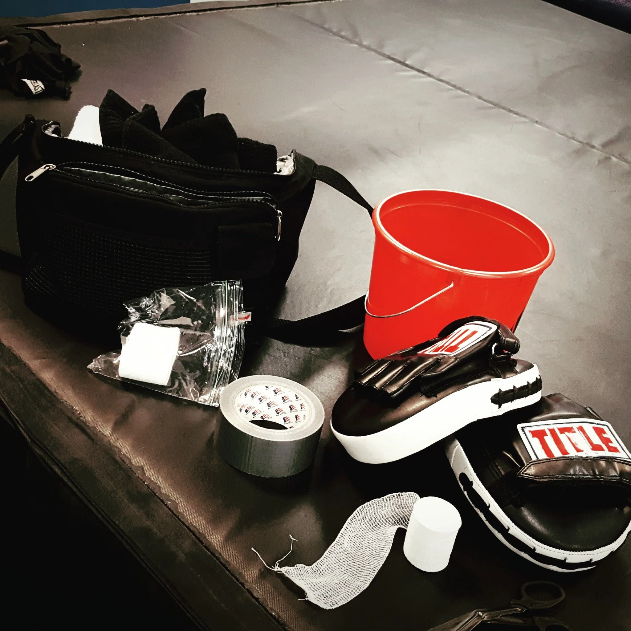 Training moments boxing mitts, bucket and gym gear at Primal Jym