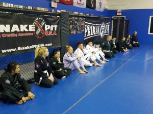 PRIMAL GYM JIU JITSI CLASS AGAINT CAGE WALL